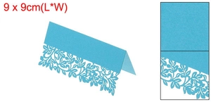 Macro detail of laser-cut floral pattern on 9x9cm light blue paper table card