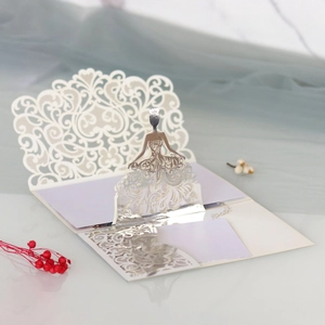 Close-up of 3D laser-cut wedding invitation featuring a purple lace dress lady design