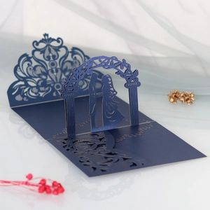 Detailed 3D laser-cut wedding invitation featuring a romantic couple under an ornate archway