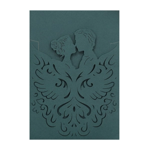 Detail showing the laser-cut silhouette of a couple on a dark green invitation card
