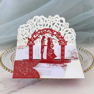 Detailed laser-cut 3D wedding card with red glitter hollow rose and couple arch silhouette