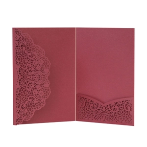 Detail showing laser-cut lace pattern and hollow pocket on wine red wedding invitation card