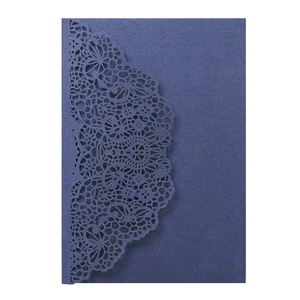 Intricate laser-cut lace floral pattern on dark blue shimmer paper wedding card