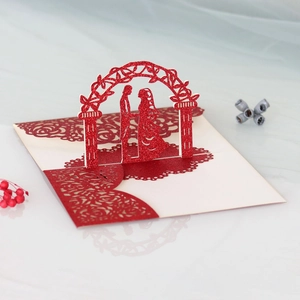 Detail of 3D pop-up wedding card featuring laser-cut rose patterns and glitter finish