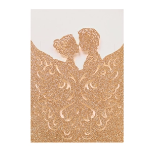 Detail of rose gold glitter wedding invitation with laser cut kissing couple silhouette