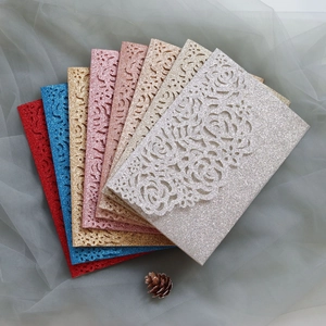 Detailed laser-cut glitter paper cards with intricate rose patterns in seven colors