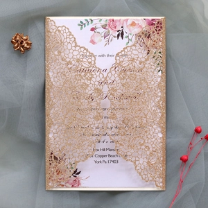 Detailed laser-cut glitter gold wedding invitation with elegant rose pattern and inner card