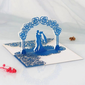 Detail view of 3D laser-cut wedding card with rose arch and blue glitter finish