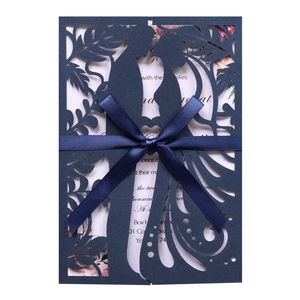 Dark blue laser cut wedding invitation with romantic silhouette and silk ribbon bow