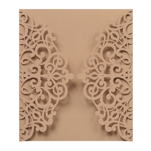 Detail of laser-cut floral patterns on kraft paper wedding invitation cover card