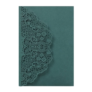 Close-up of laser-cut lace pattern on elegant dark forest green wedding invitation card