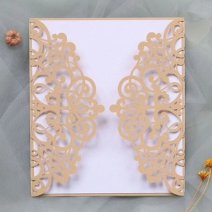 Detailed laser-cut pattern of champagne wedding invitation with European floral design