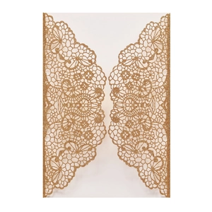 Detail of laser-cut gold glitter wedding invitation with intricate floral lace patterns