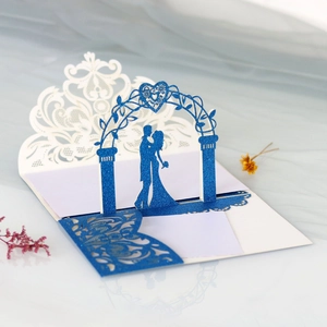 Detail showing pop-up laser cut 3D rose and couple silhouette on glitter wedding card