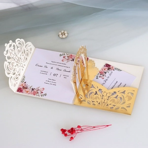 Detailed laser-cut wedding invitation set with champagne gold lace and floral inner card