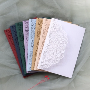 Detailed laser-cut hollow lace wedding invitation covers in various elegant colors