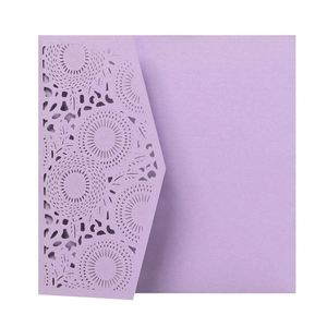 Detail of purple laser cut floral lace invitation cover with elegant pearl texture
