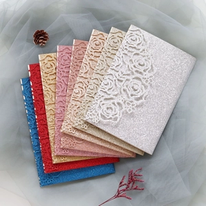 Laser-cut floral wedding invitation covers with glitter finish in seven elegant colors