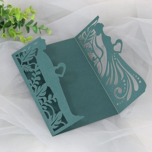 Macro detail of laser-cut lavender wedding invitation with elegant botanical patterns