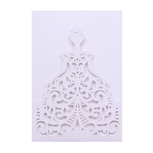 Detail of white laser cut wedding invitation card featuring elegant bridal silhouette design