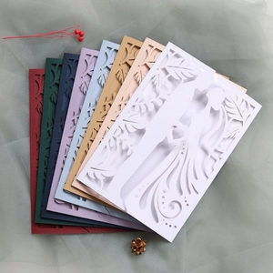 Laser-cut wedding invitation covers in various colors with bride and groom silhouette