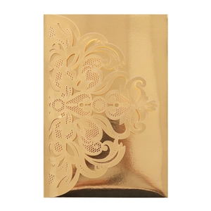 Close-up of golden laser-cut wedding invitation featuring baroque hollow floral lace detail