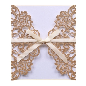 Laser cut champagne gold glitter wedding invitation with lavender insert and ribbon bow