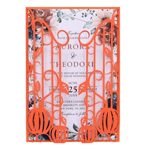 Detail of laser-cut orange pumpkin greeting card with intricate floral patterns