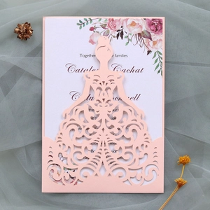 Detail of pink laser-cut princess dress wedding invitation with floral card insert