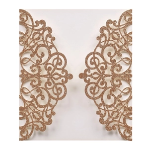 Detail of laser-cut rose gold glitter wedding invitation with European scrollwork pattern