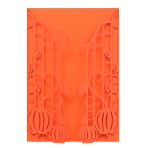 Detailed laser-cut vine and pumpkin patterns on an orange Halloween invitation card