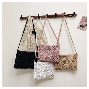Detailed close-up of handmade woven cotton tassel bags in four different colors