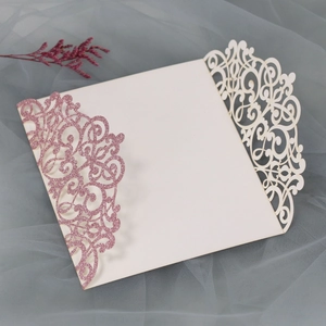 Detailed laser-cut lavender wedding invitation with glitter floral lace patterns