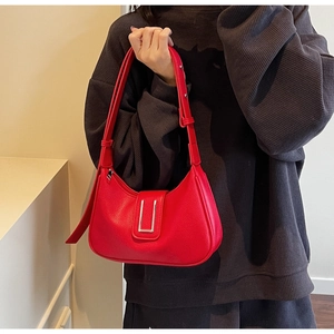 Red hobo shoulder bag with litchi grain texture and silver U-shaped metal buckle detail