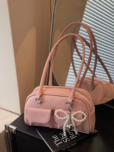 Pink lychee grain leather pillow bag with pearl bow charm and silver heart pendant