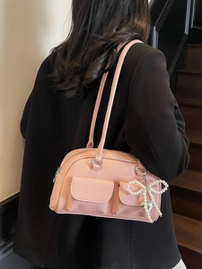 Pink lychee leather shoulder bag with pearl bow charm and silver hardware detail