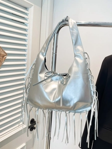 Silver metallic fringe tote bag with bow detail and bohemian tassel design for women