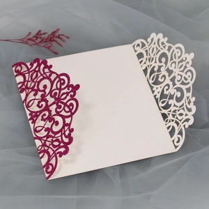 Macro shot of laser-cut European vine patterns on luxury glitter wedding invitation
