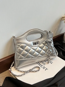 Chic silver quilted handbag with metallic finish, oval top handle and chain strap