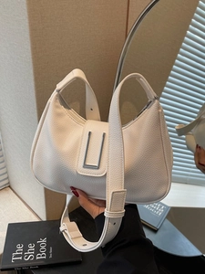 Elegant white lychee leather dumpling crossbody bag with silver buckle and wide strap