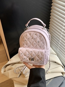 Light purple quilted mini backpack with rhinestone details and chain straps