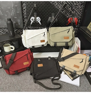 Detailed view of the large canvas messenger bag in five colors for daily commuting use