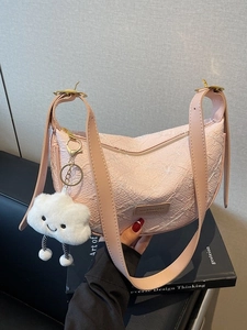Pink embossed hobo bag with a cute cloud charm and adjustable shoulder strap