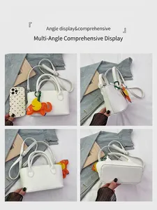 Detailed views of white lychee pattern crossbody bag with cute elephant charm decoration
