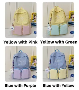 Detail view of four color-block student backpacks with embroidery and cloud charms