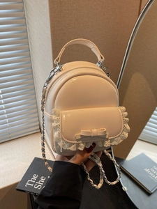 Chic beige glossy leather mini backpack with lace edge and chain strap detail