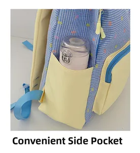Detail of color-block school backpack showing convenient side pocket with water bottle