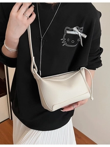 Chic cream lychee texture crossbody bag for women in minimalist half-moon shape