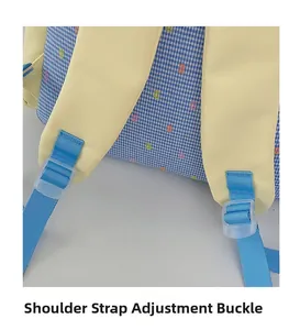 Detail of adjustable shoulder strap buckle on light blue plaid backpack for students