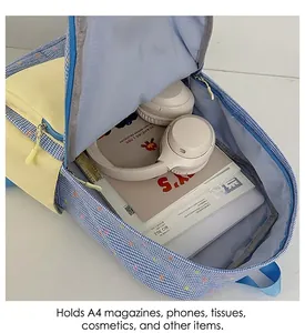 Detailed interior view of a color-block backpack showing storage space and pockets